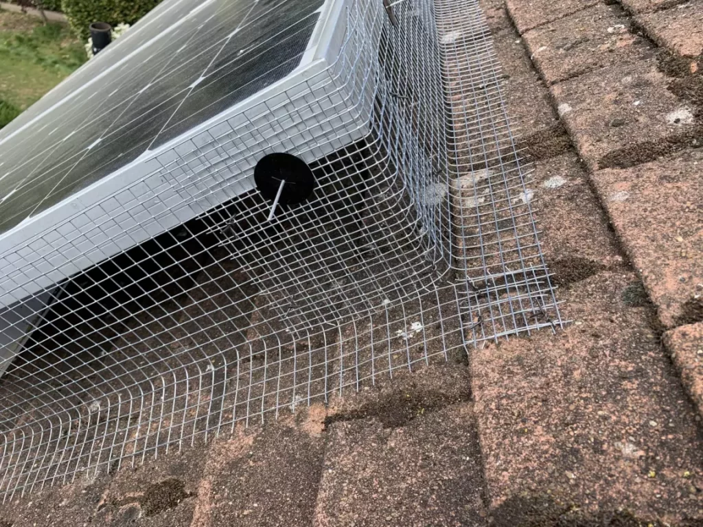 Completed Bird Proofing of Solar Panels in East Farleigh, showing the overlap of mesh to prevent bird access.
