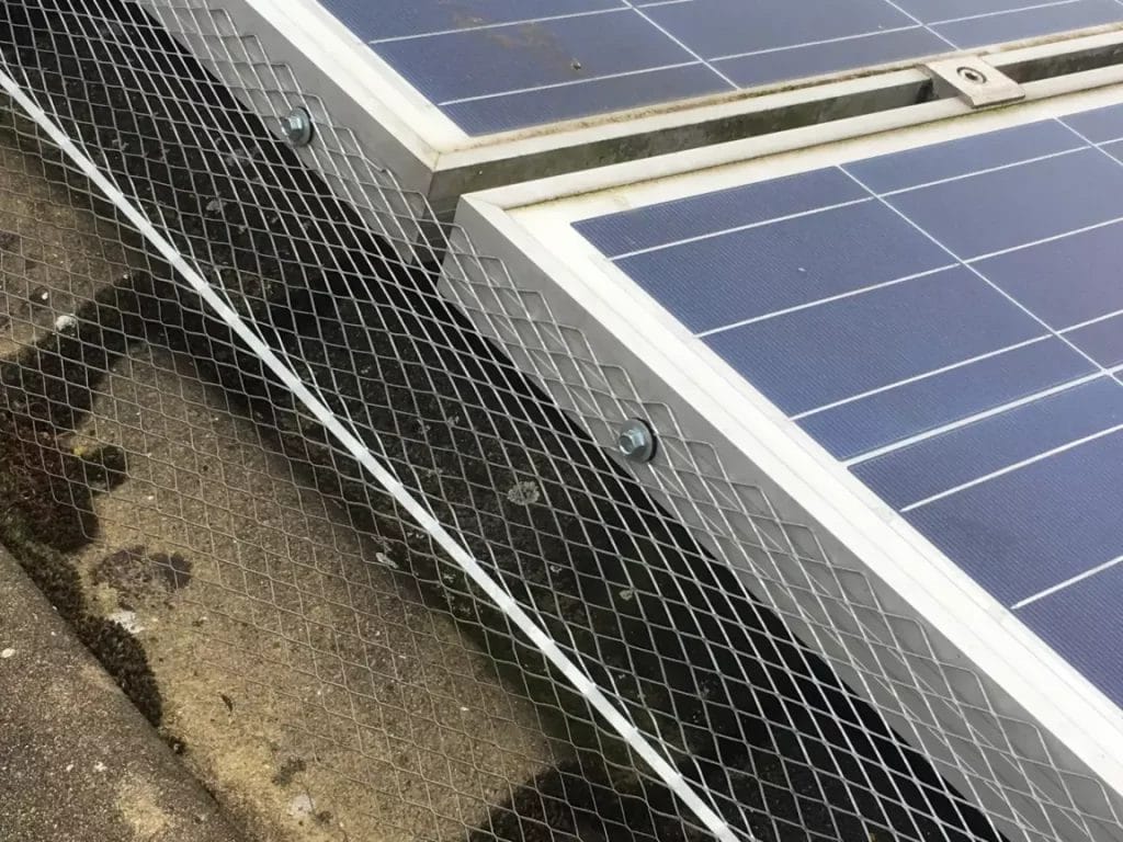 Example of work carried out by another company who had drilled directly into the solar panel array, rendering their warranty void.